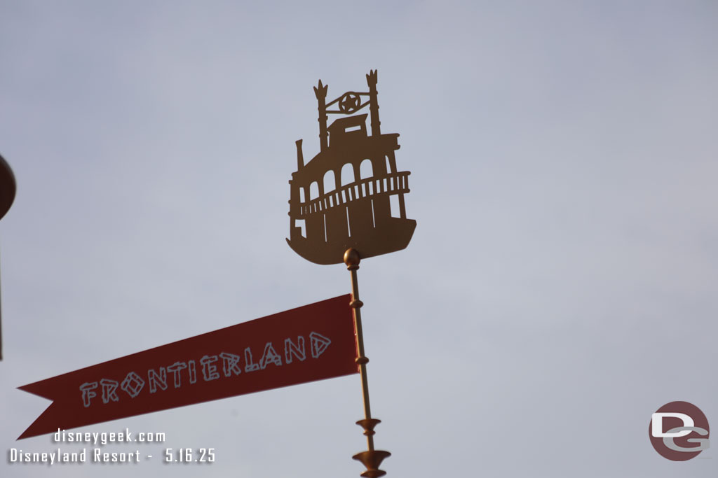 A closer look at the details of the musicbox in the esplanade. Each original land has a banner and symbol.