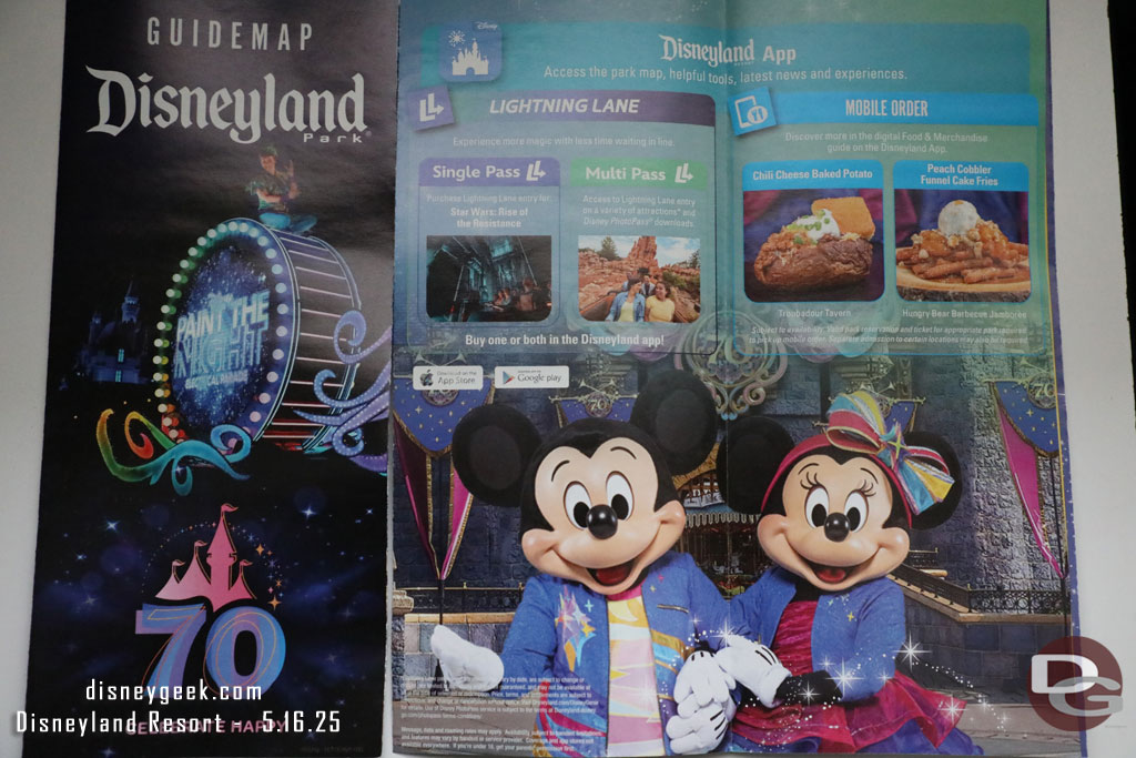 The Disneyland 70th Guidemaps feature Paint the Night on the cover and Mickey and Minnie on the interior.
