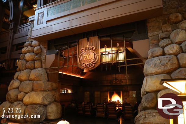 A Disneyland 70th logo over the fireplace area