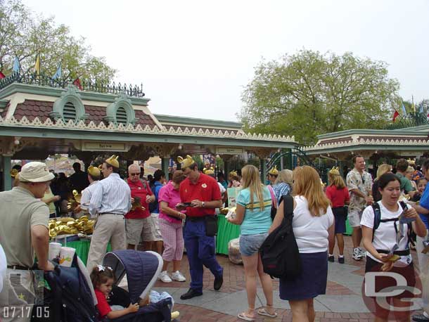 CMs passing out mouse ears and guidemaps to everyone who entered