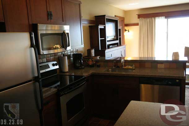 Next up a look at a one-bedroom vacation home with a park view.  You walk into the kitchen first.