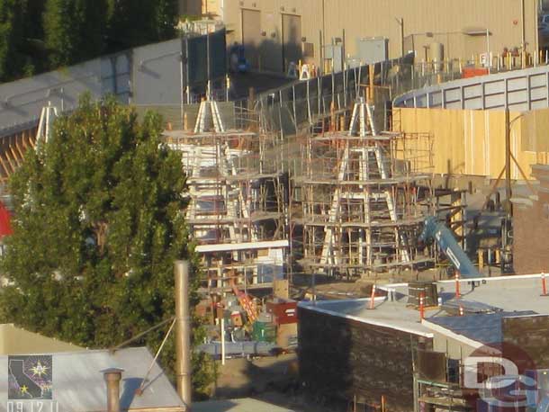 Scaffolding up around two of the cones as they await their exterior.