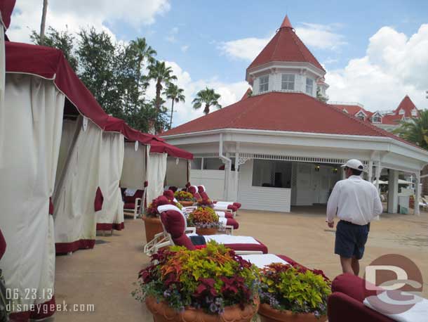 Cabanas line the pool deck.