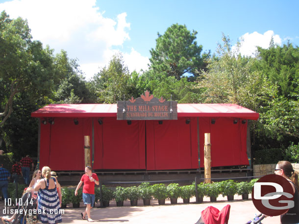 No show going on and a row of plants in front of the stage area.