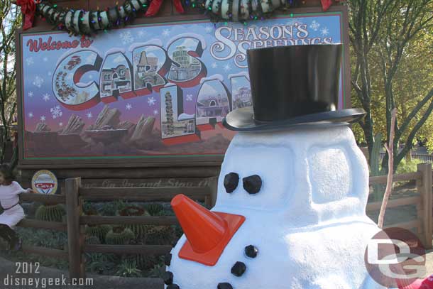 Greeting everyone as they turn onto Route 66 is Snowy the Snow car.
