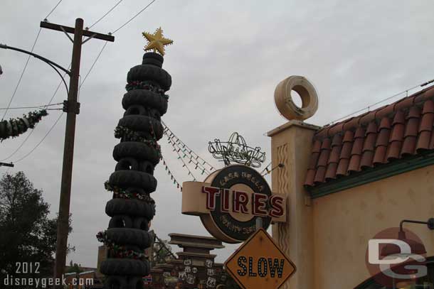 Across the street Luigis leaning tower of tires has been made into a giant Christmas tree.