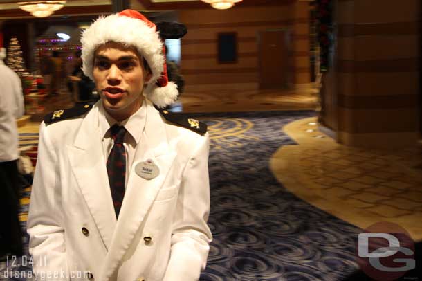 Heading on board.. a member of the cruise staff waits once you step into the atrium.