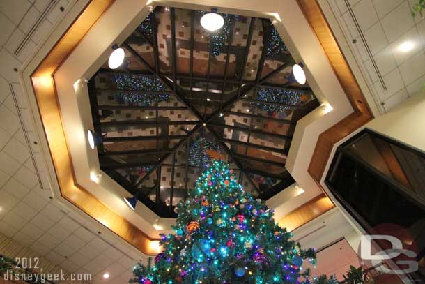 Looking up at the tree and the glass ceiling before moving on to the next hotel.