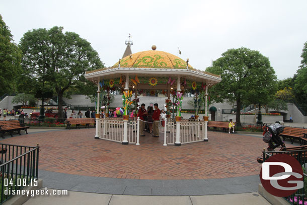 Behind us a bandstand/gazebo decorated for the springtime.