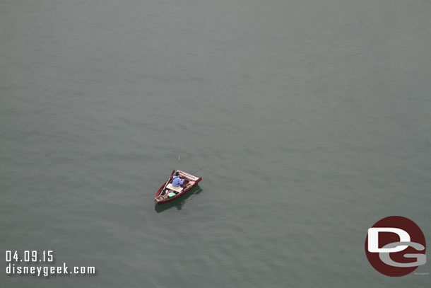 A random person fishing below in the channel.