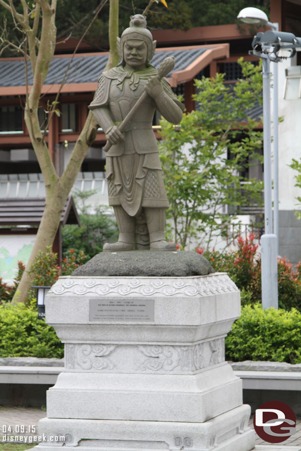 Statues line the walkway.