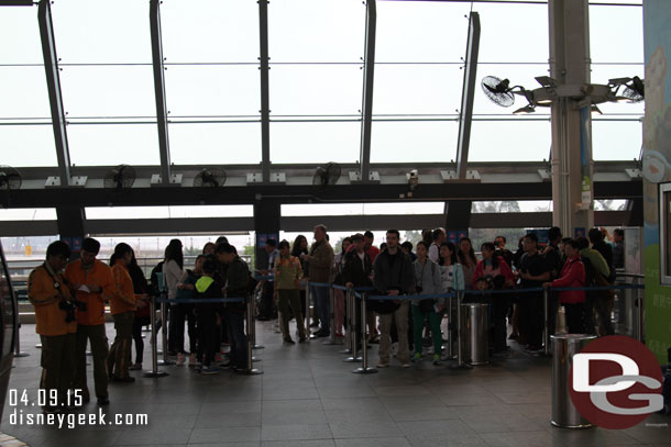 A line of people waiting to go up into the fog.