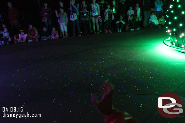 The ground and audience were being painted with lights.