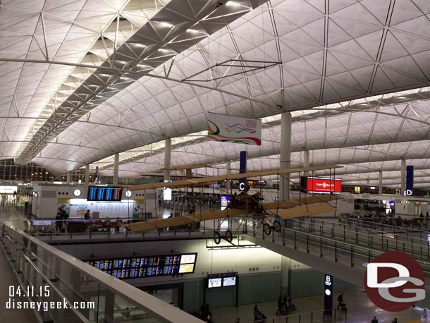 Stepping into the Hong Kong airport.  Down below is arrivals