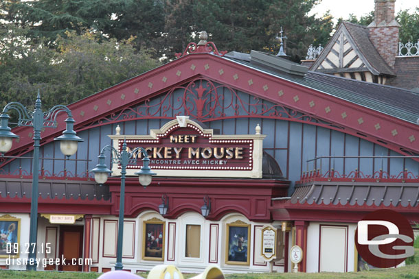 A large building to meet Mickey Mouse sits in front of the Fantasyland train station.  This looked awkward to me. 