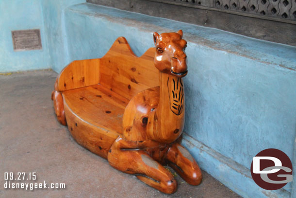 A bench near the entrance to Adventureland from Main Street.