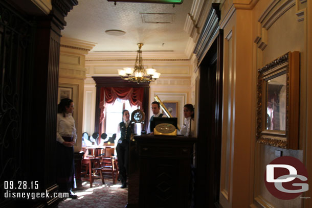 At the top of the steps another podium then you are seated in one of the dining rooms