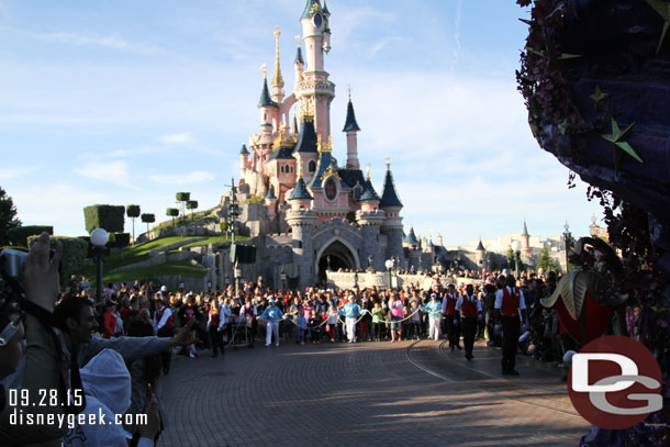 The end of the parade and mass of guests approaching.