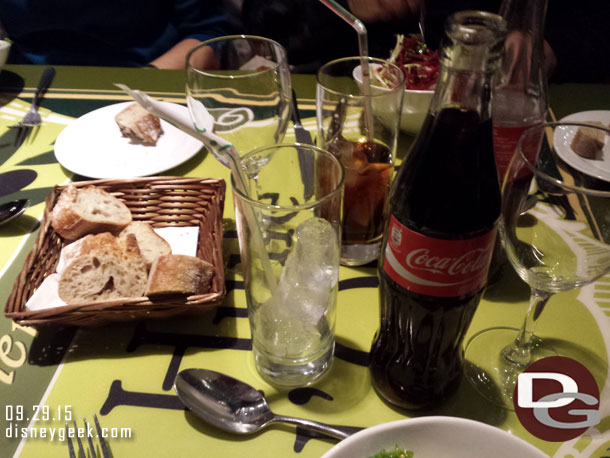 Coke is once again served in a glass bottle.  Also in the picture is the bread.