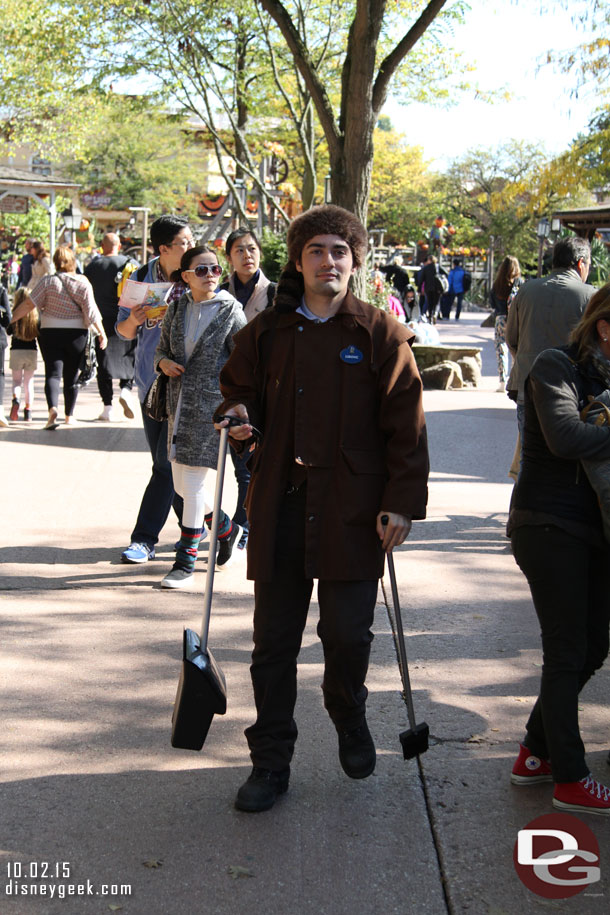 Some of the custodial cast members had area specific costumes..  most areas in the US parks do not do this anymore.