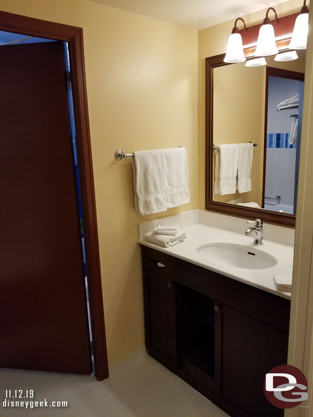 The bathroom area.  Under the sink on the right is the refrigerator.