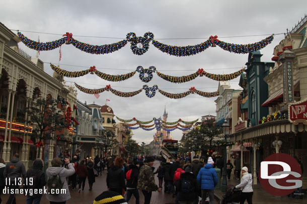 Main Street USA features six large garlands featuring LED lights, bells, and Mickey wreaths that span the street.