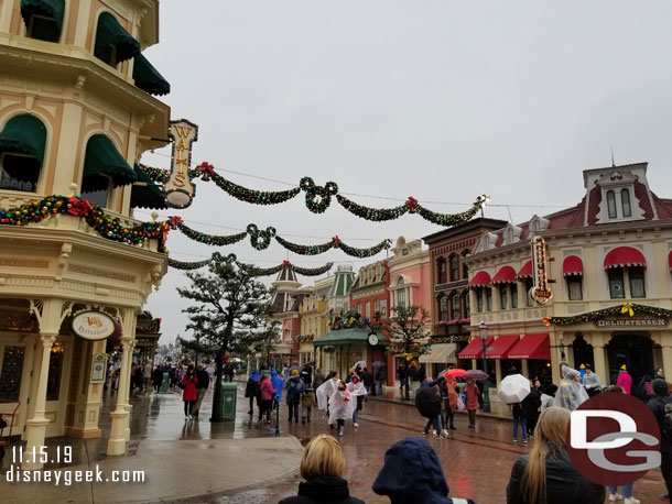 Walking out of the park in the rain.  The bells were ringing and Disney snow was trying to fall.. but the rain was stopping it.
