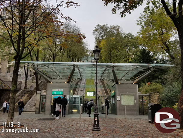 The Funiculaire de Montmartre is a tram to take you up a good portion of the hill.  You can use your transit pass to ride (or buy a ticket).