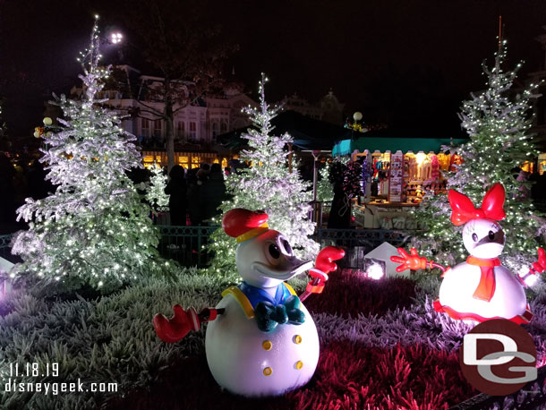 Donald and Daisy snow figures in Town Square.