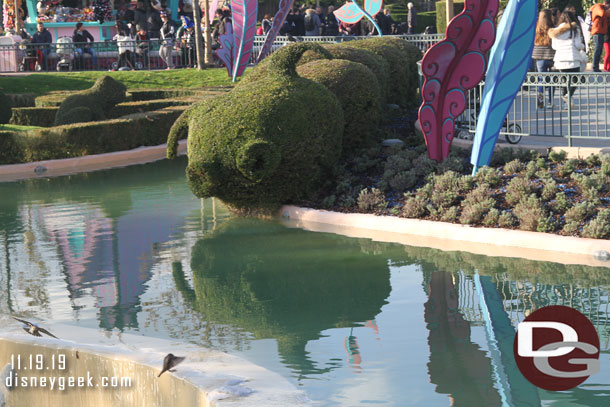 A caterpillar topiary near the Mad Hatters Tea Cups