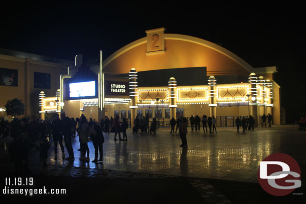 A crowd assembling for the 6:00 Surprise Mickey Christmas Special that starts in 5 minutes.