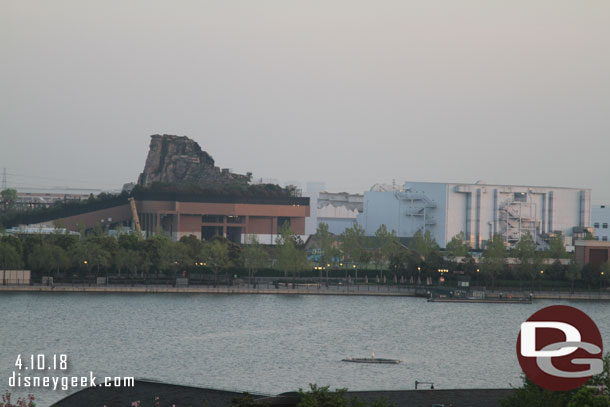 Panning up, this is to the right of the Castle, rising above the building is the rock formations of Adventure Isle, in the foreground are the show buildings for Roaring Rapids (the brown building) and to the right Soaring.