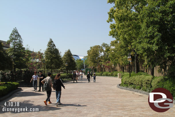 This pathway leads from Fantasyland to Tomorrowland.  To the left is Peter Pan to the right behind the trees and wall is Toy Story Land.