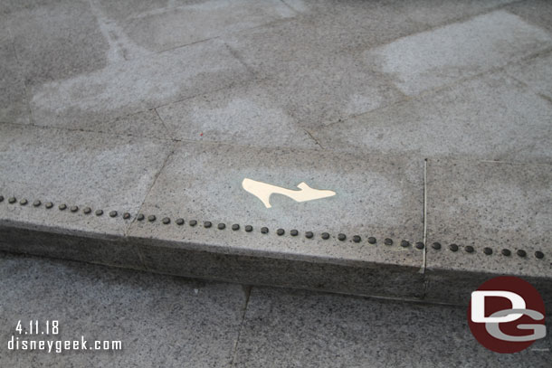 A glass slipper inlaid in the steps.