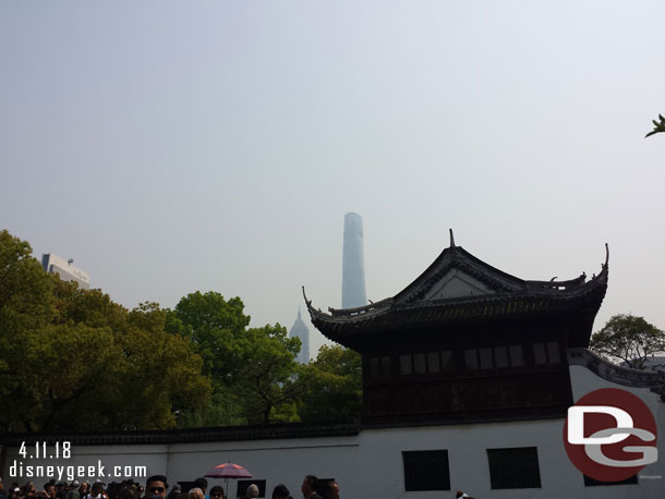 Near the entrance to the Yu Garden.  The city rising behind.