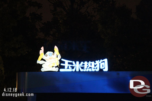 Stitch's Corn Dog sign at night.