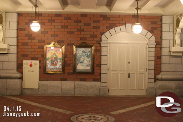 Walking  under the station a couple attraction posters.