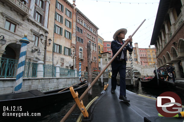 Onboard and cruising the canals.  The cast members looked to be working hard to move and guide the gondolas.