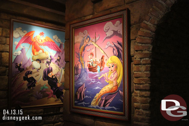 The queue has posters of key scenes from the voyage