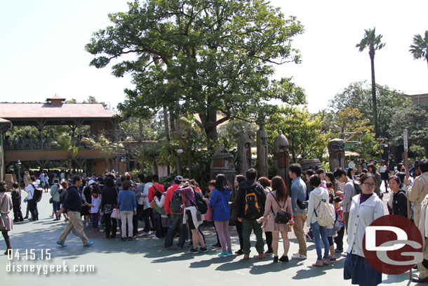 The queue went off toward the attraction in the distance and wrapped around.