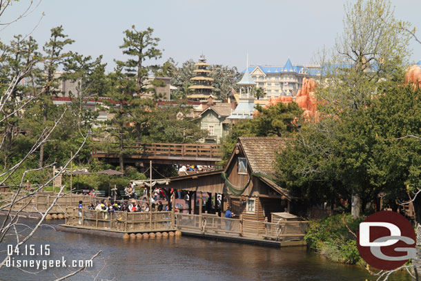 Tom Sawyer Island dock in the foreground.. behind it Westernland and then the Tiki Room in Adventureland and the background the Disneyland Hotel.