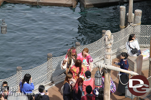 Captain Jack Sparrow on the dock below meeting guests.