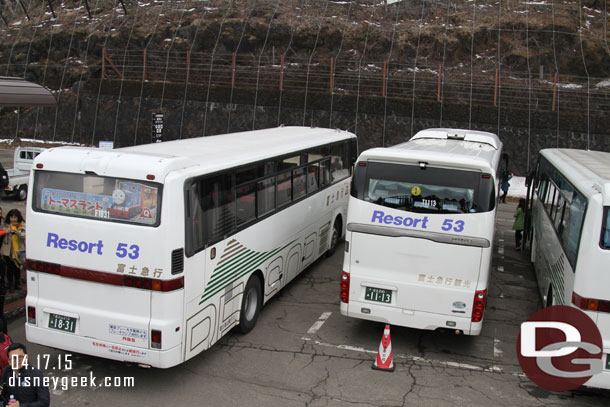 The buses lined up in the parking lot.