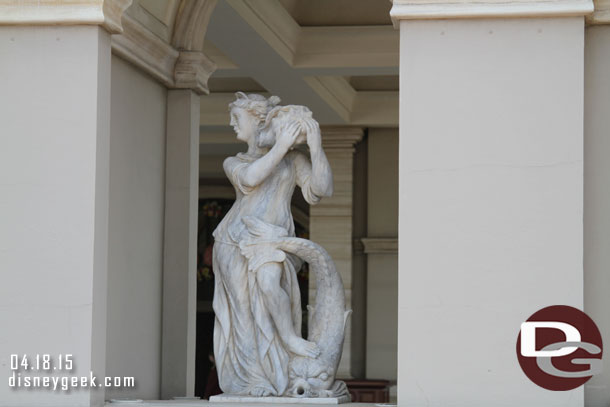 Statues flank the entrance area.