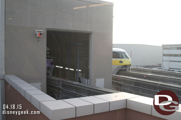 A Monorail in the round house and one waiting at the siding.