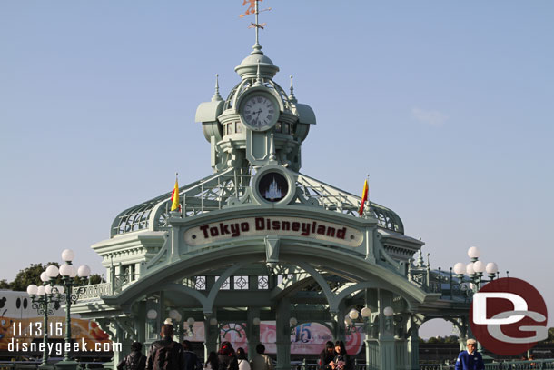 Walking toward Tokyo Disneyland as a 15th Anniversary Resort Liner passes by.