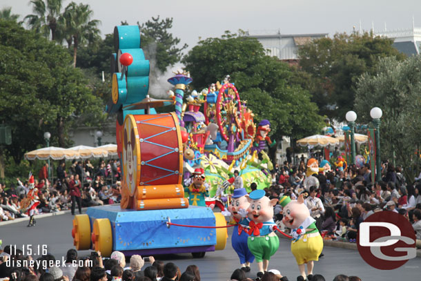 The three little pigs pulling the Mickey toy.