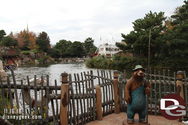 The fishing bear has a prime location along the Rivers of America.