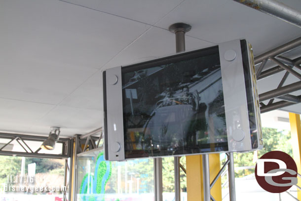 TV monitors in the garage playing clips from Disneyland and the first Autopia.