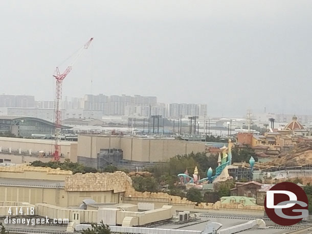 The crane is for Soaring Construction. The large building to the right is for the attraction.